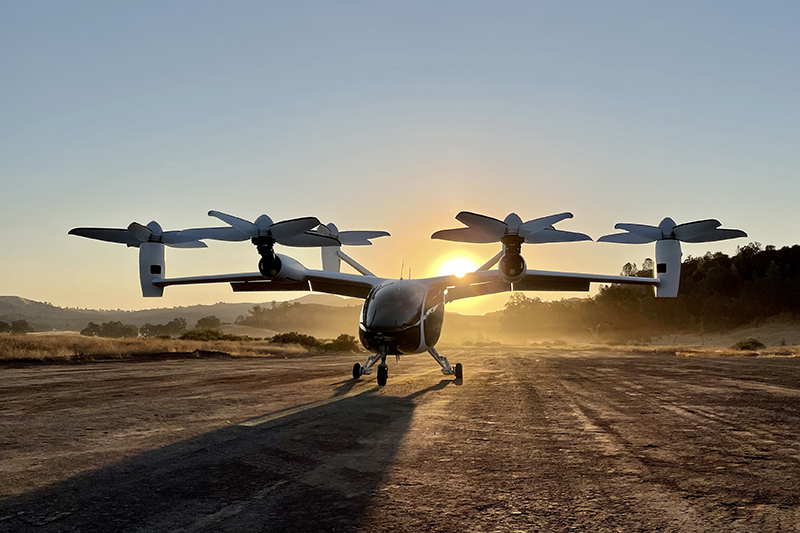 Sun sets behind a Joby prototype VTOL aircraft.