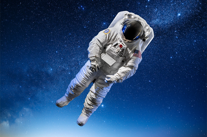 Full space suit floating on a background of stars